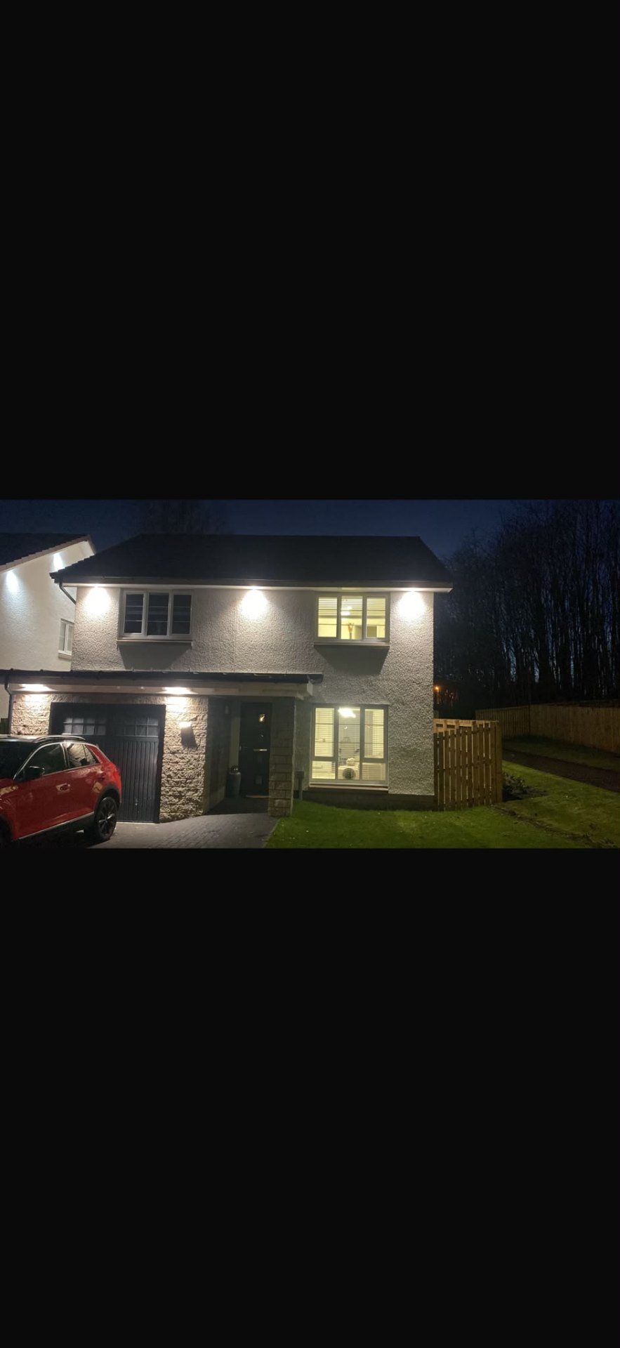 Soffit lighting installation by Electrust — LED downlights under the eaves of a Scottish home