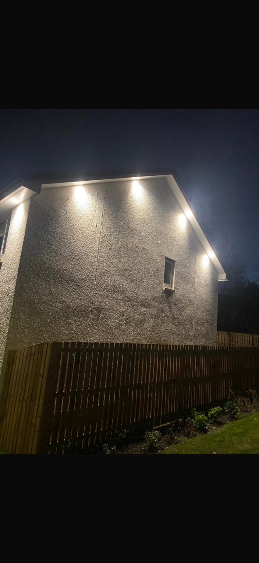 Soffit LED lighting illuminating a Scottish home at night by Electrust
